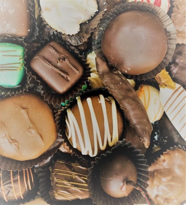 Assorted chocolates with black paper wrapping